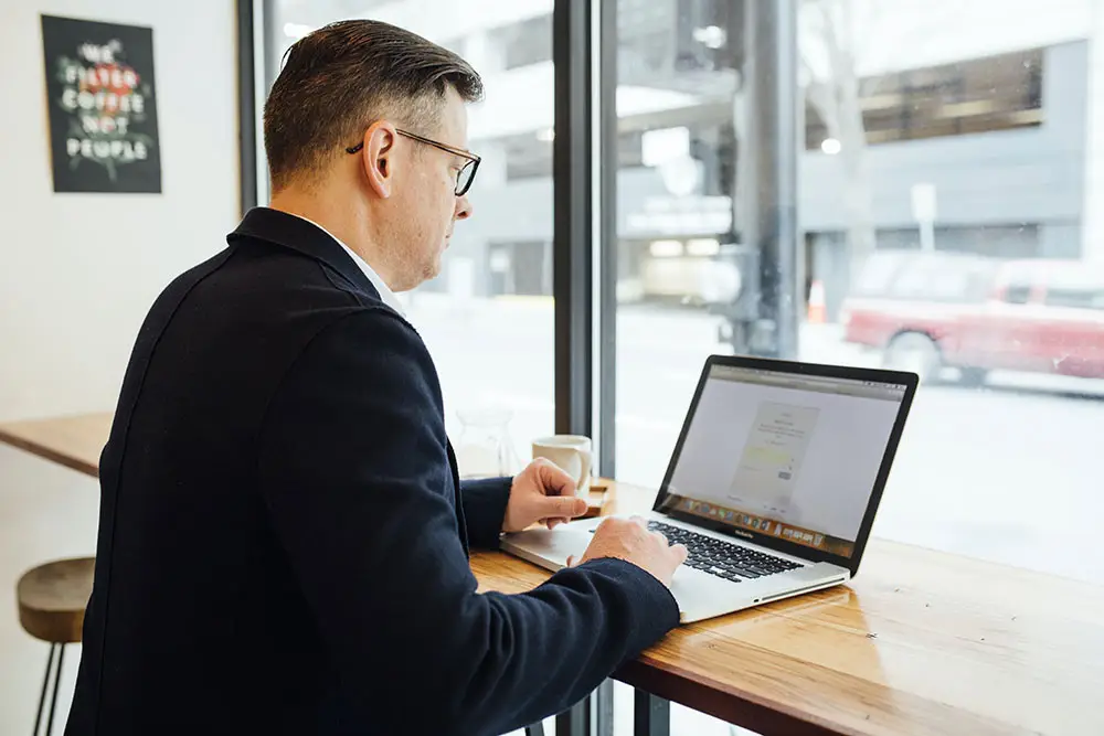 seo services in leicester man by window
